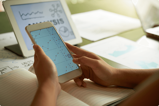 cropped-unrecognizable-person-analysing-financial-chart-smartphone 1 1