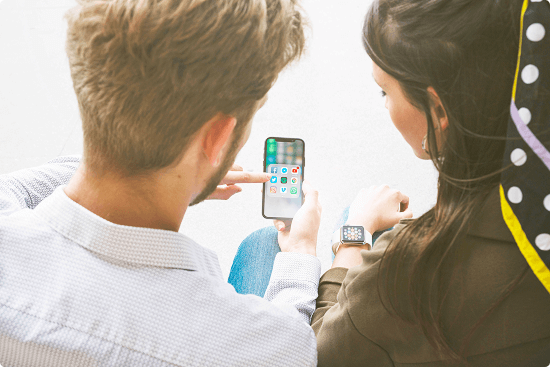 friends-using-application-mobile-phone-by-connecting-with-smart-watch 1 (1) 1